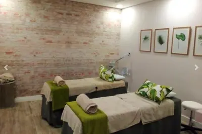 a hospital room with two beds and a brick wall at 1253 The Blyde Crystal Clear 3 Bedroom Garden Apartment in Pretoria