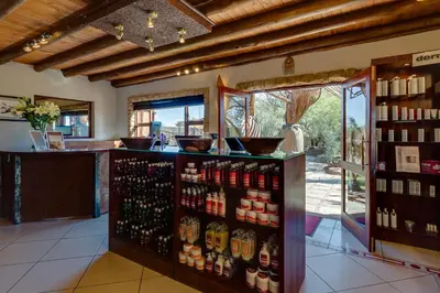 a store with a counter with many bottles of alcohol at Zebula Golf Estate and Spa - Zebula Golfers Lodge in Mabula