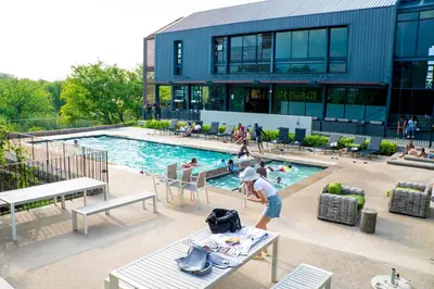a person standing in front of a swimming pool at Secure 1 Bedroom Apartment in Midrand, Waterfall City - Lock Up and Go - Free WIFI and Parking - 7 Elizabeth Place in Midrand