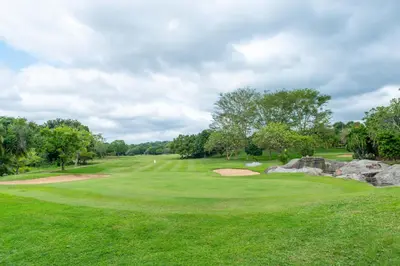 a view of a golf course with a green at Kruger Park Lodge Unit No. 516 in Hazyview