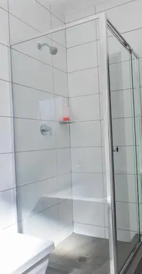 a bathroom with a shower with a glass door at Large 3 Bedroom Apartment in Midrand, Waterfall City - More space than a hotel room - Ideal for families, groups and work trips - 19 Elizabeth Place in Midrand