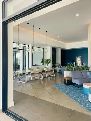 a living room with a couch and a table at One Bedroom The Blyde in Pretoria
