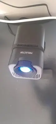 a light hanging from the ceiling of a toilet at A humble abode that is cozy in Centurion