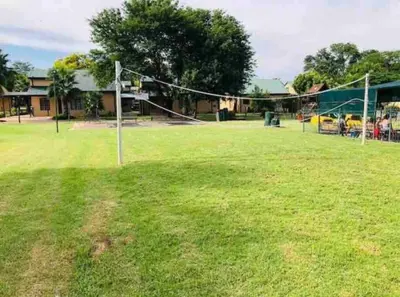 a volleyball court with a net in a field at 20 Pendleberry Holiday Resort in Bela-Bela