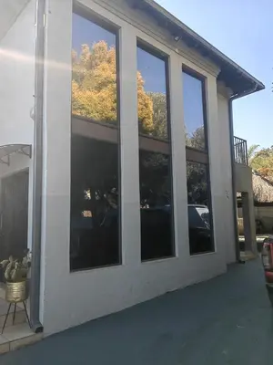a group of windows on the side of a house at Choosers Express Boutique Hotel Room 4 in Centurion