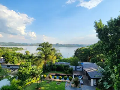 an aerial view of a house with a lake in the background at Lake View in Hartbeespoort