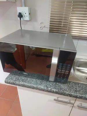 a microwave oven sitting on top of a counter at American horses in Pretoria