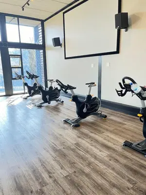 a row of exercise bikes in a gym with a whiteboard at Spacious 2 Bedroom Apartment in Midrand, Waterfall City - Business and Family friendly - 13A Elizabeth Place in Midrand