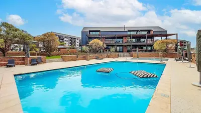 a large swimming pool in front of a building at Modern Retreat in Waterfall Midrand with Pool & Restaurant in Kyalami