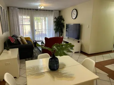 a living room with a vase on a table at 2e - No load shedding 2 bed home to relax into in Centurion
