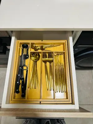 a drawer filled with gold forks and spoons at Homely Stay 2 in Kempton Park