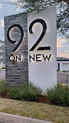 a sign that says on new at Luxury Apartments in Midrand