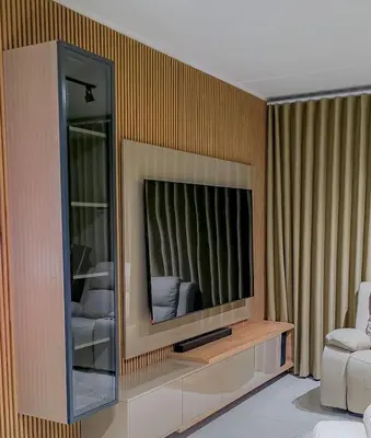 a living room with a television in a wall at THE BLYDE CRYSTAL LAGOON F&S LUxurious Apartment 3bed in Pretoria