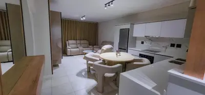 a kitchen with a table and chairs in a room at The Blyde 3bed Beach Facing F&S Luxurious 2 in Pretoria