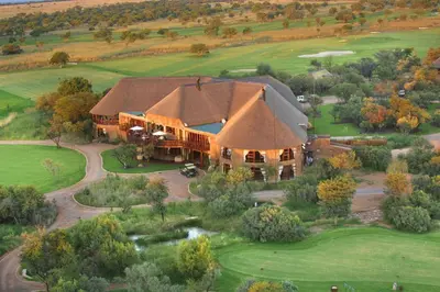 an overhead view of a large house with a large roof at Zebula 1 Pela Lodge, 6 bedrooms in Warmbaths