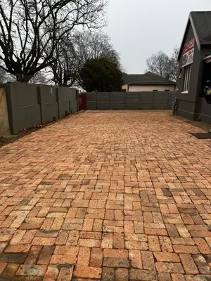 a brick driveway in front of a house at Private 4 Double Room Guest Wing, Comfortable, Secure Parking, Wi-Fi, Ensuite Bath in Ermelo