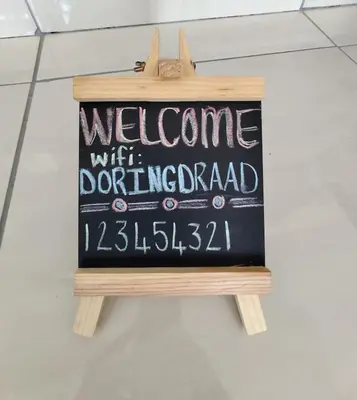 a sign that says welcome with a donuturger at Doringdraad Lodge Nala and Zazu in Brendan Village
