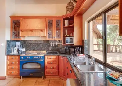 a kitchen with a blue stove and a sink at 205 Zebula, 4 bedroom house in Warmbaths