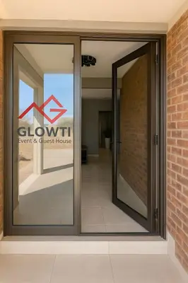 a sliding glass door with a sign for a gym and guest house at Glowti Event & Guest House in Centurion