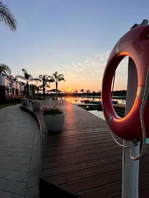 a boardwalk with a large orange lifesaver on it at The Corinthians in Pretoria