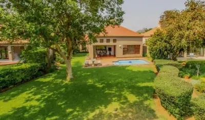 an aerial view of a house with a yard at Pecanwood Haven Hartbeesport Dam in Hartbeespoort