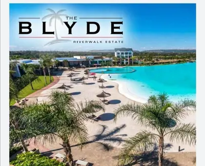 a magazine cover of a resort with a beach with palm trees at The Blyde Crystal Lagoon Pretoria 3Bed in Pretoria