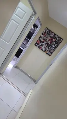 an empty room with a refrigerator and a window at Ntale Guest House in Benoni