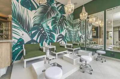 a salon with green and white chairs and a mural at Waterfall Midrand Lifestyle Luxe in Midrand