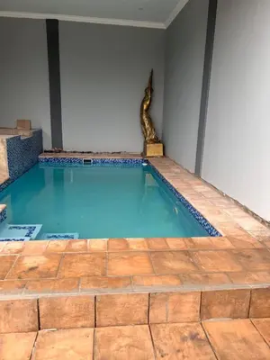 a swimming pool with a snake in a room at MorningMist Boutique 27 Room 2 in Centurion