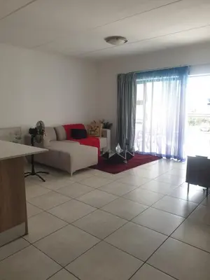 a living room with a couch and a table at The Blyde resort in Pretoria