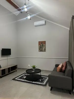a living room with a couch and a table at Pendleberry Grove 90 in Bela-Bela