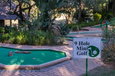 a sign in front of a mini golf course at Kruger Park Lodge Unit No 440 in Hazyview
