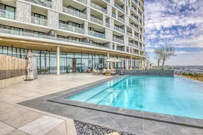 a swimming pool in front of a building at Nova Luxe Midrand Waterfall Ellipse Galileo in Midrand