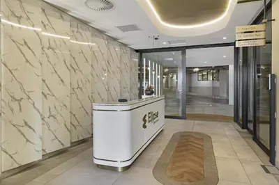 a lobby with a reception desk in a building at Serene Spaces, Ellipse in Midrand