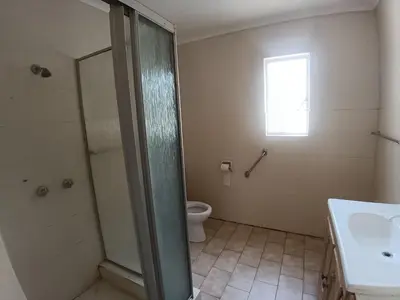 a bathroom with a shower and a toilet and a sink at 12 Bologna B&B in Evander