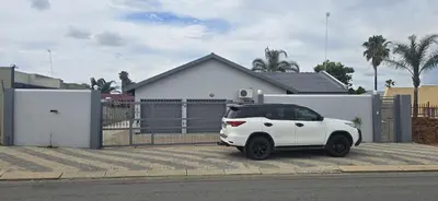 a white car parked in front of a house at Good night guest house in Polokwane