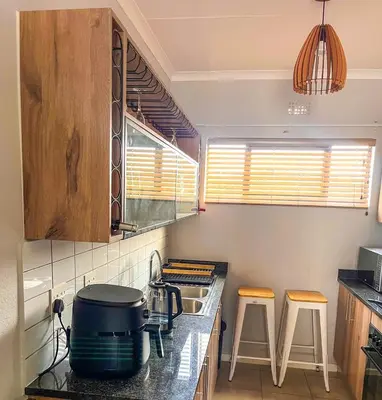 a kitchen with a stove and a pot on a counter at Chillasclub BNB-SAFUBI VIEWS in Nelspruit