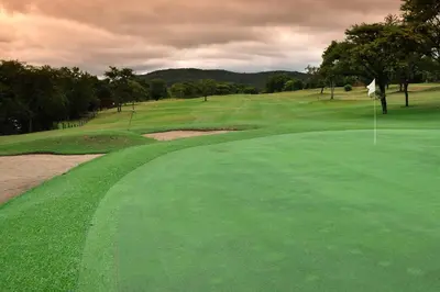 a view of a golf course with a green at Kruger Park Lodge Unit No. 612 in Hazyview