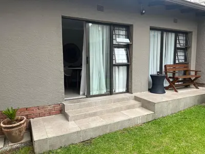 a house with a set of stairs leading to a patio at Annie’s Place Self Catering 2 in Kempton Park