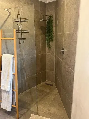 a bathroom with a shower with a glass door at Annie’s Place Self Catering 2 in Kempton Park
