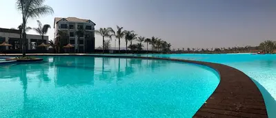 a large pool with blue water in a resort at Insaka 1 The Blyde Crystal Lagoon Experience in Pretoria