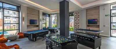 a room with three pool tables and two trampoline at The Blyde in Pretoria