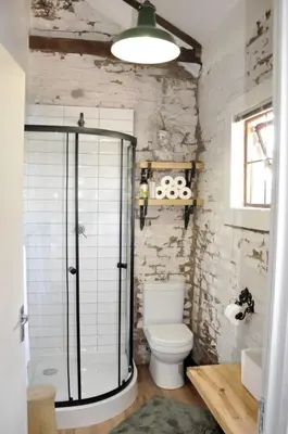 a bathroom with a toilet and a glass shower at SOUSIE'S RUSTIC STAY in Polokwane