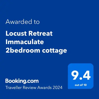 a screenshot of a phone with the text awarded to locust retreat immaculate at Locust Retreat Immaculate 2bedroom cottage in Marloth Park