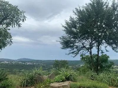 a tree sitting on top of a hill at Hazyview Accommodation, Bon Repose Cottage 2 in Hazyview
