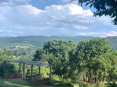 a gazebo on a hill with mountains in the background at Hazyview Accommodation, Bon Repose Cottage 1 in Hazyview