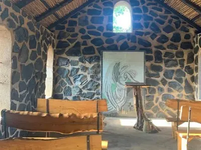 a room with a painting of a fish on a wall at Hazyview Accommodation, Bon Repose Cottages 3&4 in Hazyview