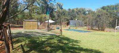 a backyard with a pool with a fence and afficient at Vulture's View 9 in Hartbeespoort