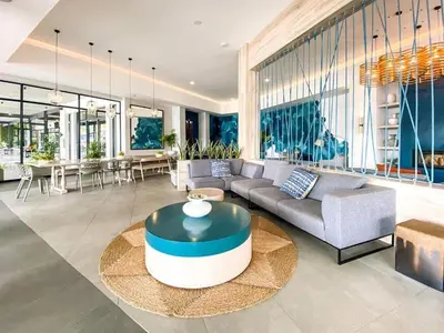 a living room with a couch and a table at Luxury beach lagoon 1 Bedroom apartment in Pretoria