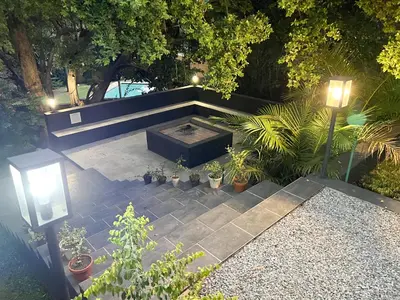 an overhead view of a patio with plants and a fire pit at Afrique134 Willow Tree Private Garden Suite in Pretoria